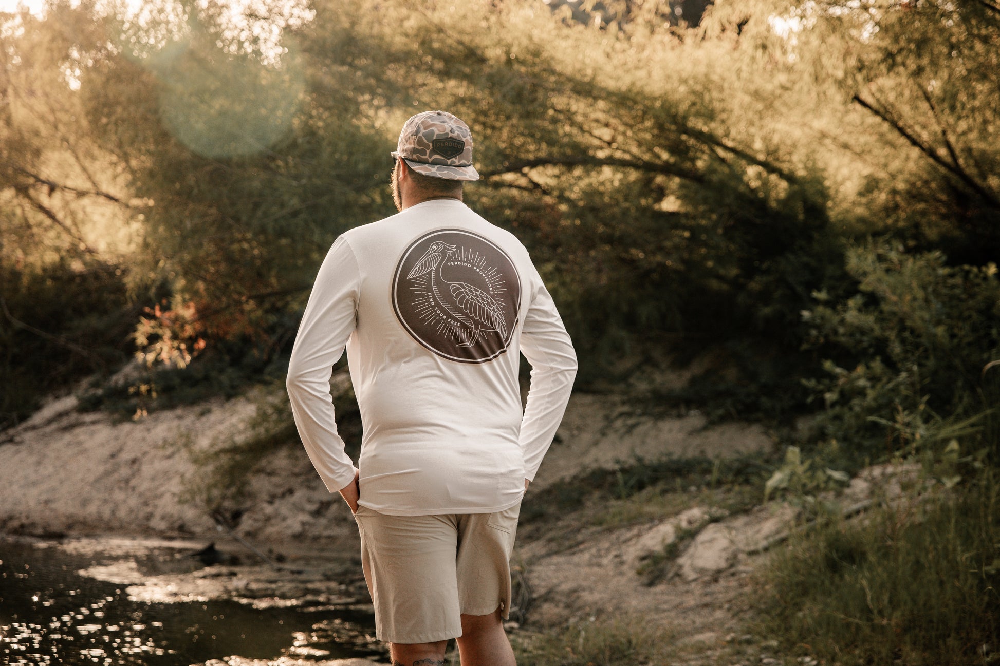Performance long sleeve in white with brown sublimated pelican logo